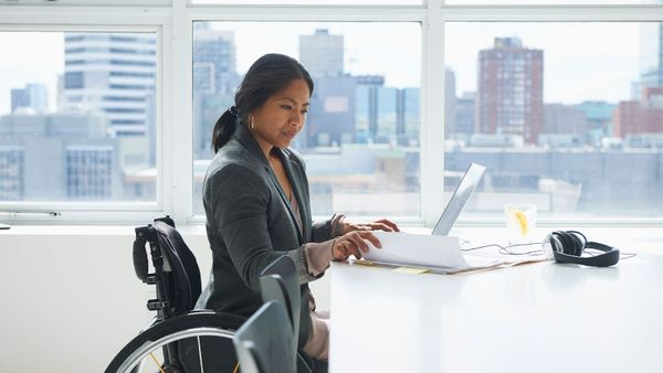 woman in wheelchair at computer