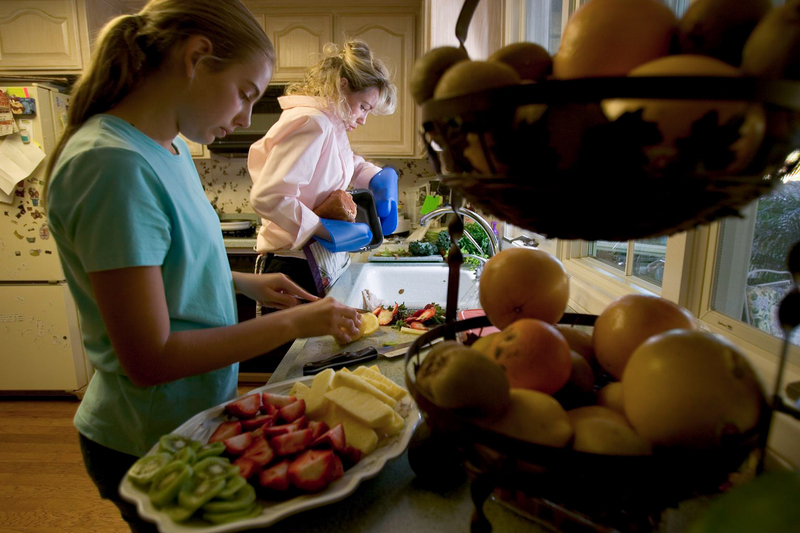The Hoxie family, who are Adventists in Loma Linda, Calif., prepare dinner. Seventh-day Adventists follow a diet that emphasizes nuts, fruits and legumes and is low in sugar, salt and refined grains.