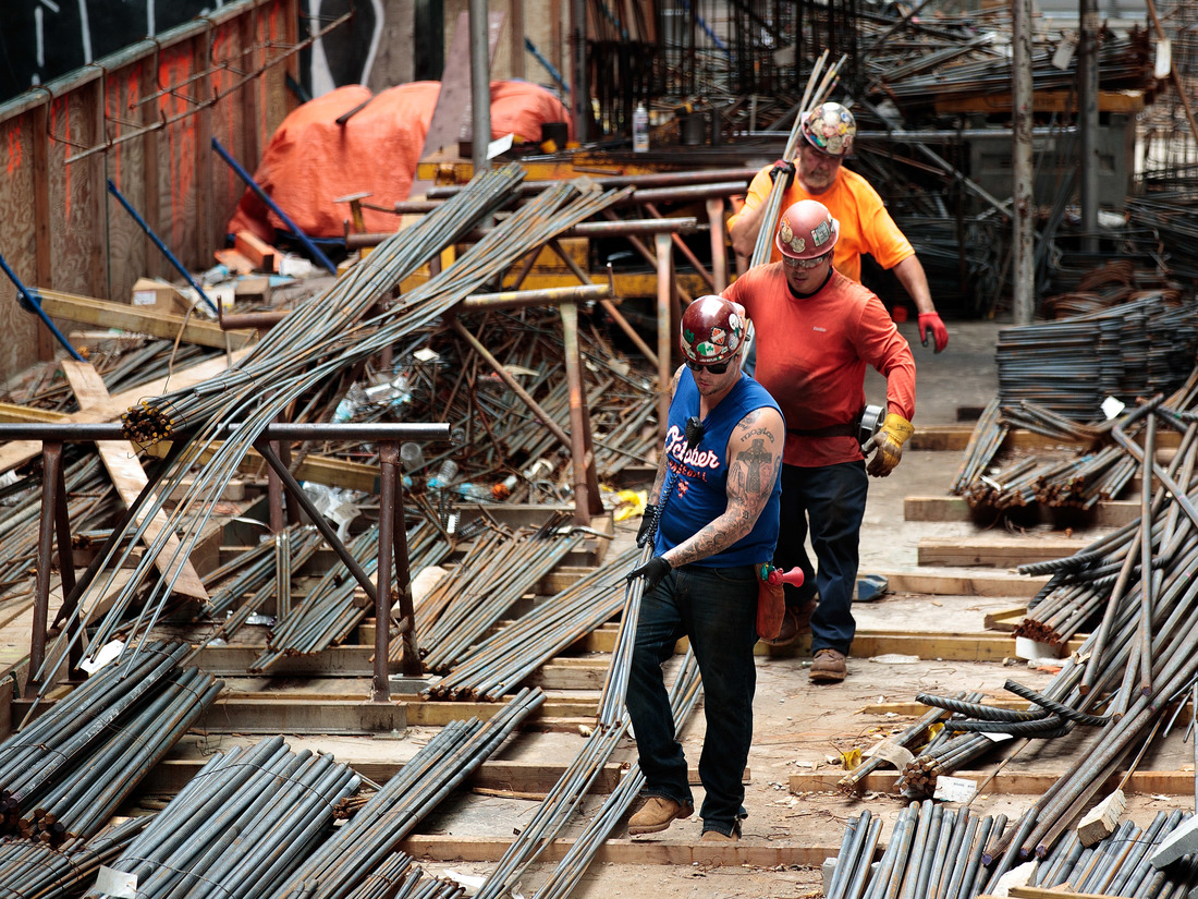 NEW YORK, NY - AUGUST 16: Construction laborers work on the site of a new residential building in the Hudson Yards development, August 16, 2016 in New York City.