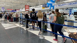 Travelers line up to get into the security checkpoint at Chicago's O'Hare airport last summer.