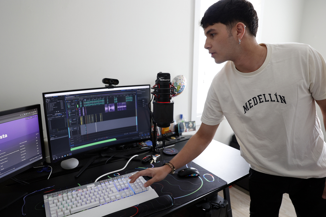 Vargas Arango shows his home recording setup in his Miami apartment.