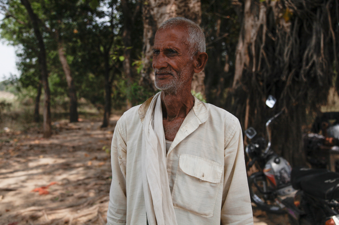 A man named Shivanandum poses for an image by the Ganges River in the town of Chausa. He conducts the last rites for Hindus before their bodies are cremated by the riverbank, their ashes submerged in the Ganges.