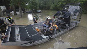 Hundreds are rescued from their homes after Houston area flooding