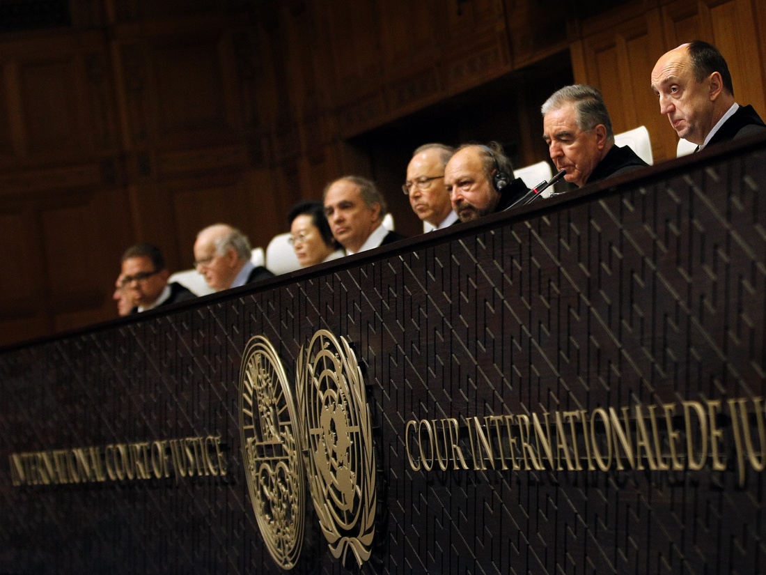 Members of the jury sit in the International Court of Justice in The Hague, The Netherlands, on January 27, 2014.