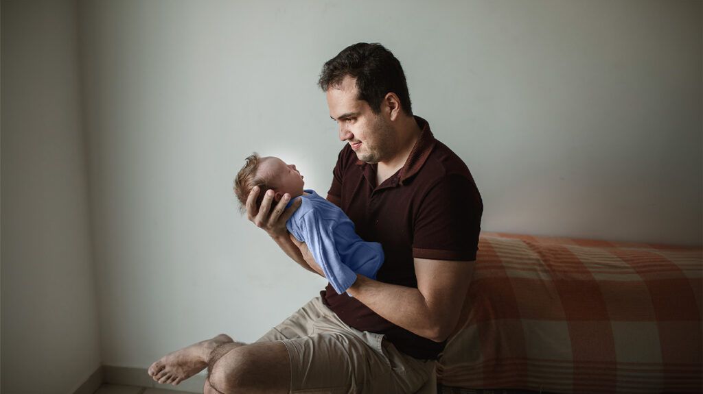 A parent holding a baby with croup. -2