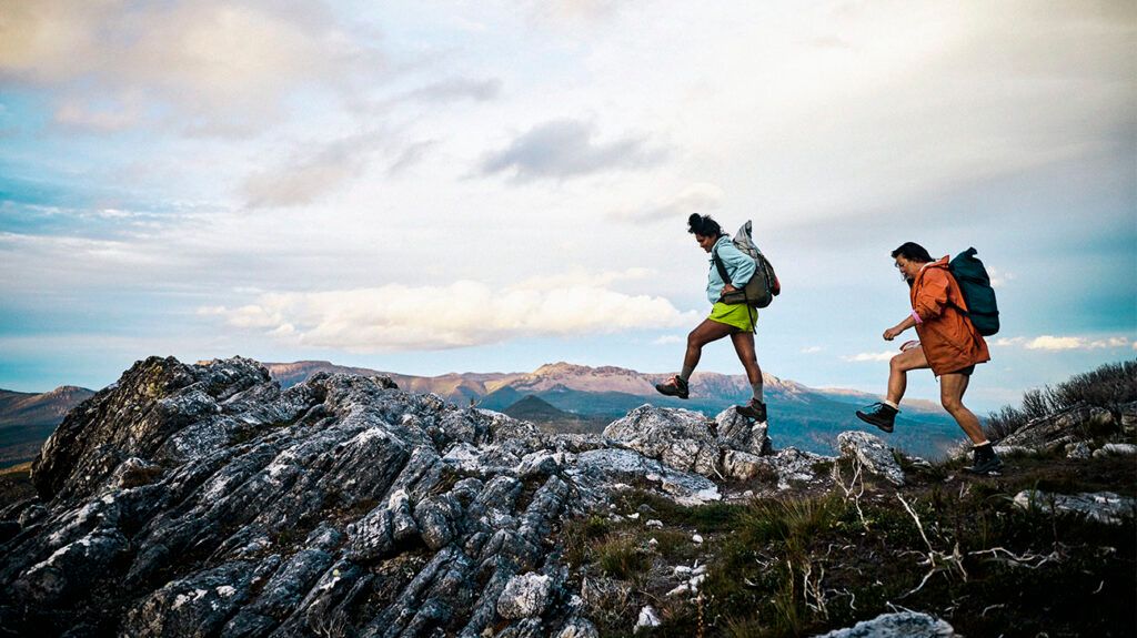 Two people hiking on a mountain