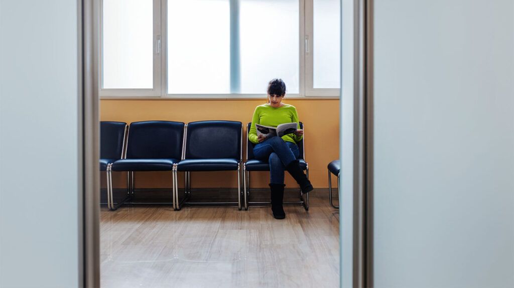 person in clinic waiting room