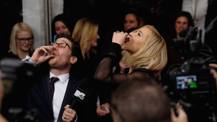 Jennifer Lawrence Takes Bourbon Shots on Mockingjay-Premiere Red Carpet