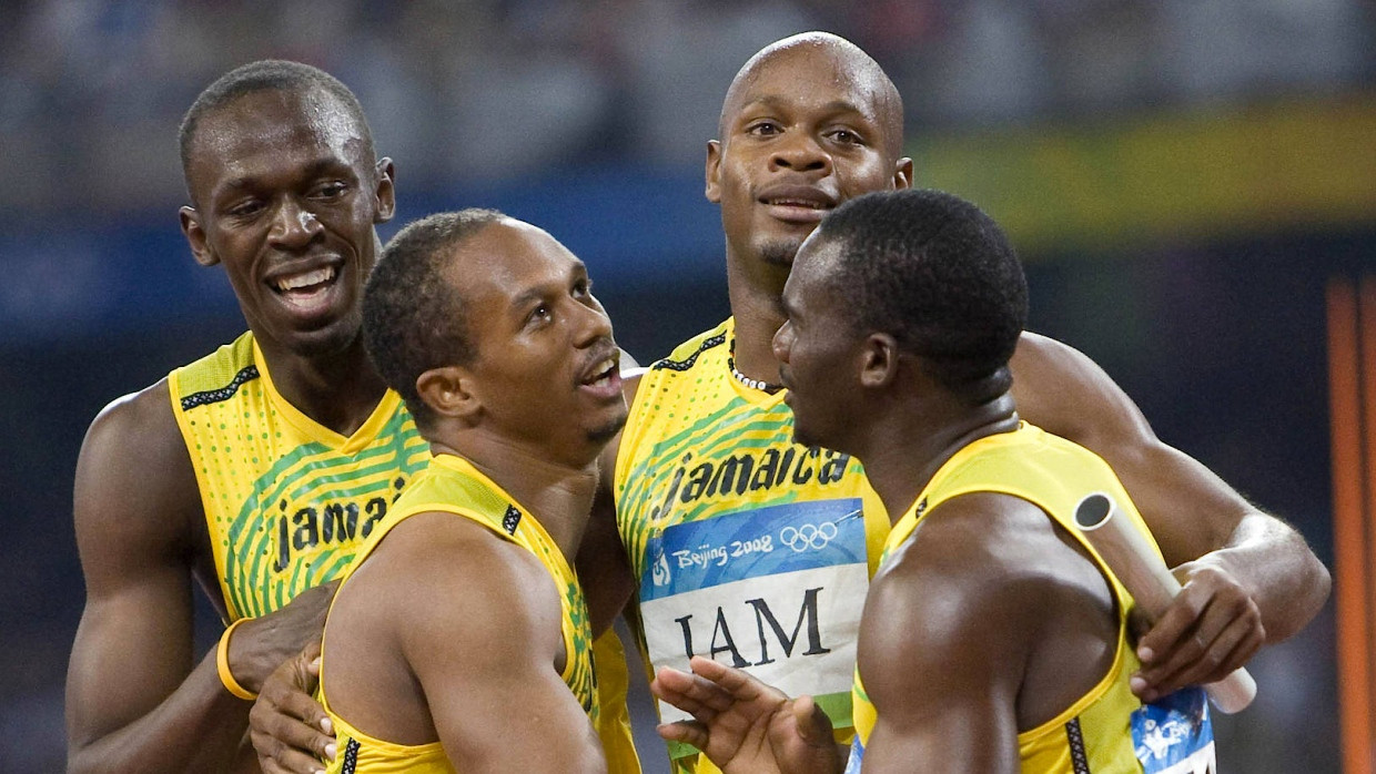 Ein Pekinger Gold weniger: Usain Bolt (l.) muss wegen Nesta Carter (r.) eine Goldmedaille zurückgeben