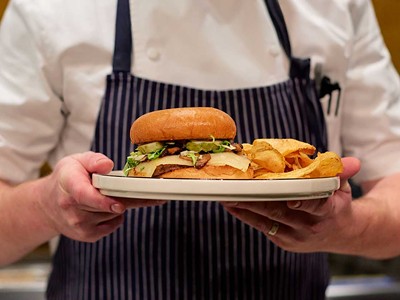 At Hamilton’s, servers wear aprons with the Carhartt logo to commemorate a previous business on the site: a clothing factory owned by Hamilton Carhartt.