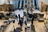 Passengers pass through TSA at JFK airport.