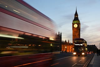 Photo of London with Big Ben and red buses