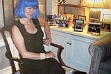 Me in my blue wig in my apartment