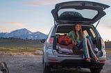 Nicole Jordan in the back of her van while outdoors.