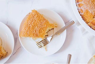 Plates of kunafa on a table, photographed from above