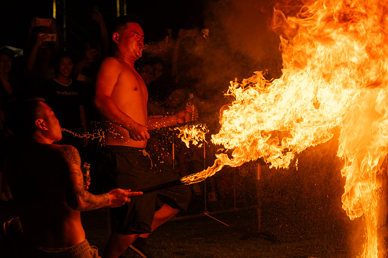 Performers showcase fire breathing stunts at a cultural performance in Foshan City, Guangdong Province, August 16, 2024. /CFP