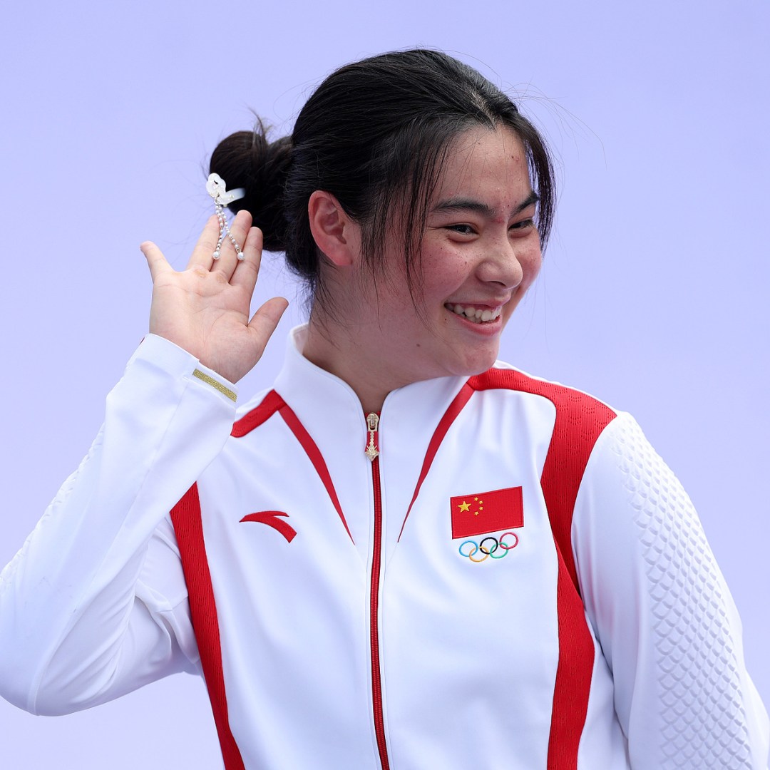 China's women's BMX freestyle gold medalist Deng Yawen celebrates. /CFP Photo