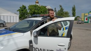 Oleksii Kharkivskyi, the chief of the patrol police of Vovchansk, in his police car in an undisclosed location in Kharkiv Oblast, Ukraine, on May 26.