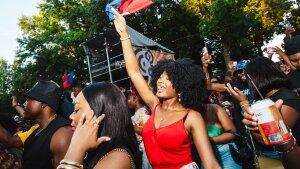 Fans cheer in the crowd at Michaël Brun's BAYO concert at Lena Horne Bandshell in Prospect Park, Brooklyn, New York on Saturday, June 15.