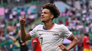 USA's Kevin Paredes celebrates scoring his team's second goal during a group match at the Paris Olympics between the United States and Guinea on Tuesday in Saint-Etienne, France. The U.S. defeated Guinea 3-0 to advance to the quarterfinals.