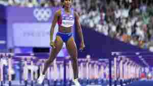 Masai Russell, of the United States, wins the women's 100-meter hurdles final at the 2024 Summer Olympics, Saturday, Aug. 10, 2024, in Saint-Denis, France. (AP Photo/Petr David Josek)