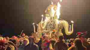 Attendees dance during the annual Burning Man Festival in the early morning of Sept. 5, 2023. Thousands of revelers were stuck in the mud for days last year.