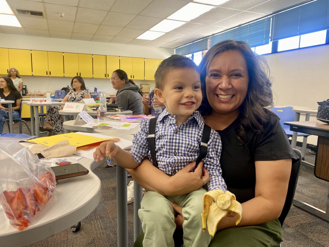 Elvia Elena Nunez and her grandson Esteban sit in a classroom in Phoenix.