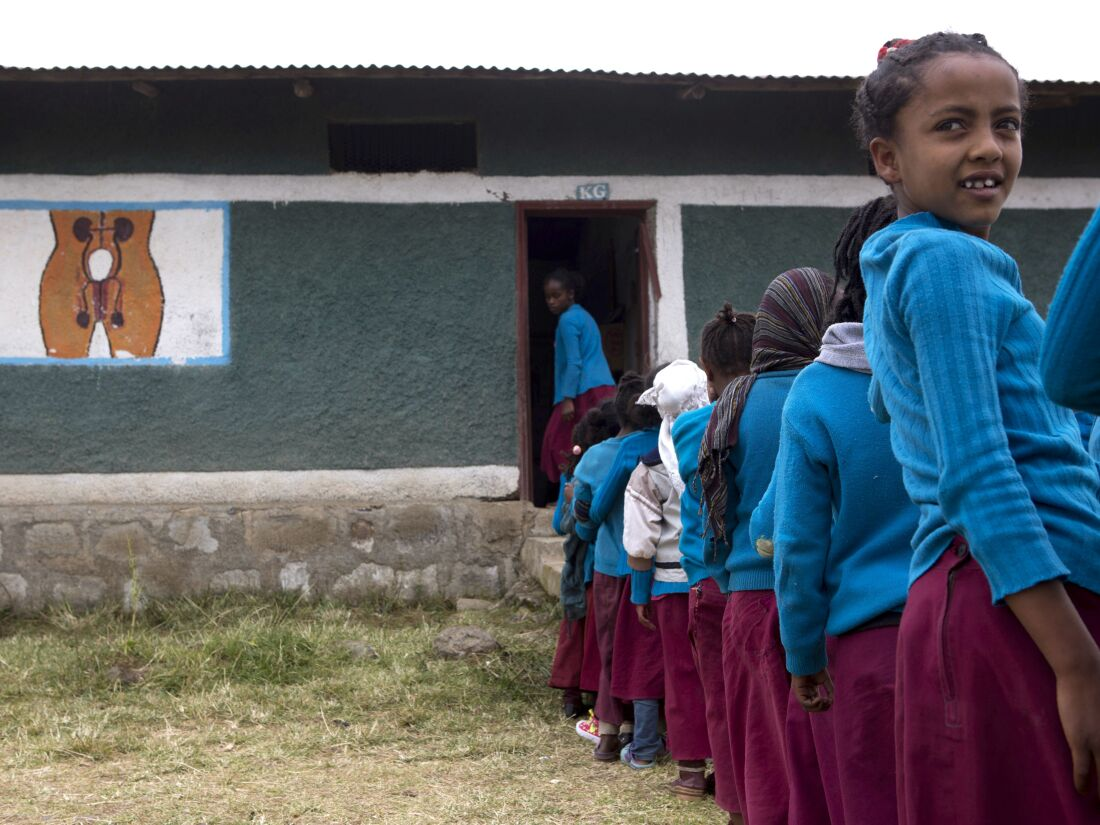 Young girls queue to enter the primary school in Sheno, Ethiopia on October 18, 2017. In partnership with UNICEF, the Sheno Primary School developed a program with counseling on menstruation and sanitary pad for young student girls. Both male and female students participate in lessons on the girls menstruation for a better understanding and integration in schools.