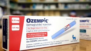 In this photo illustration, boxes of the diabetes drug Ozempic rest on a pharmacy counter on April 17, 2023, in Los Angeles. The front of the long rectangular box says 