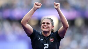 Maher lifts her hands in celebration after Team USA's rugby sevens victory.