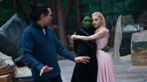 Jon M. Chu directs Cynthia Erivo and Ariana Grande on the set of Wicked.