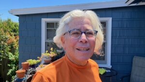 Judith Dambowic, a multiple myeloma patient, on her porch in Oakland, CA, right before shaving her head in preparation for a stem cell transplant in May. Dambowic wanted California to pass a law regulating Medigap insurance policies. The reform, which ultimately failed, would have made it easier for her to switch her coverage from Medicare Advantage to traditional Medicare.