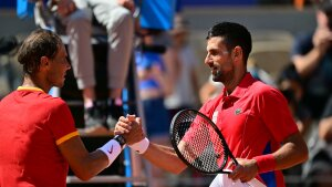 Serbia's Novak Djokovic, right, shakes hands with Spain's Rafael Nadal after the two faced off in the Paris Olympics — their 60th matchup overall. Nadal has been battling injuries for years, but he rallied for a number of dramatic points in front of an appreciative crowd at Court Philippe-Chatrier at the Roland-Garros Stadium at the Paris 2024 Olympic Games, in Paris on July 29, 2024. (Photo by Martin BERNETTI / AFP) (Photo by MARTIN BERNETTI/AFP via Getty Images)