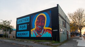 A colorful mural reads "Justice for Manny" and a Black man smiling.