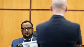 Defense attorney Jared Ausserer cross-examines forensic pathology expert Dr. Roger Mitchell during the trial of three Tacoma Police officers in the killing of Manny Ellis at Pierce County Superior Court, Monday, Oct. 16, 2023, in Tacoma, Wash. Tacoma Police Officers Christopher Burbank, Matthew Collins and Timothy Rankine stand trial for charges related to the March 2020 killing of Manny Ellis.