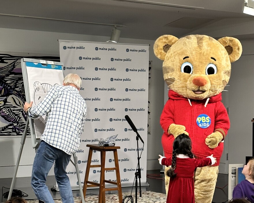 Daniel Tiger on stage at a Literacy Tour event.