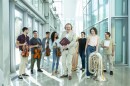 New World Symphony conductor and Artistic Director Stéphane Denève (Center) and a group of NWS Fellows