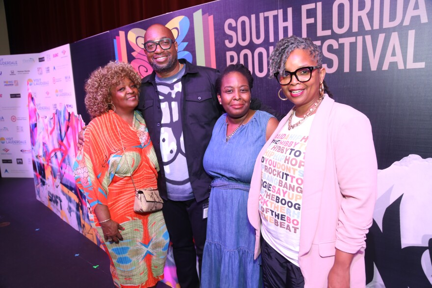 Renee Foster of the Universal Hip Hop Museum, Author Kwame Alexander, AARLCC Assistant Manager Sheena Sewell, AARLCC Regional Manager Dr. Tameka Hobbs at the South Florida Book Festival.