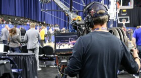 A camerman captures a Louisiana high school basketball tournament (New Orleans girls beat Baton Rouge!). His is one of many thousands of jobs created by the NBA All-Star Game.