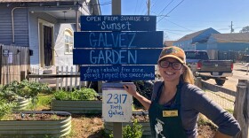 Lissie Stewart stands beside the business sign for Galvez Garden in New Orleans on Feb. 25, 2024.