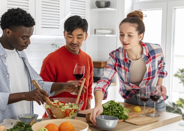 Group of young adults preparing a meal