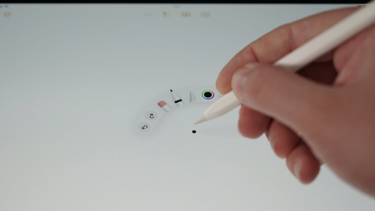 A hand holding Apple Pencil Pro above iPad Pro showing a tool modal