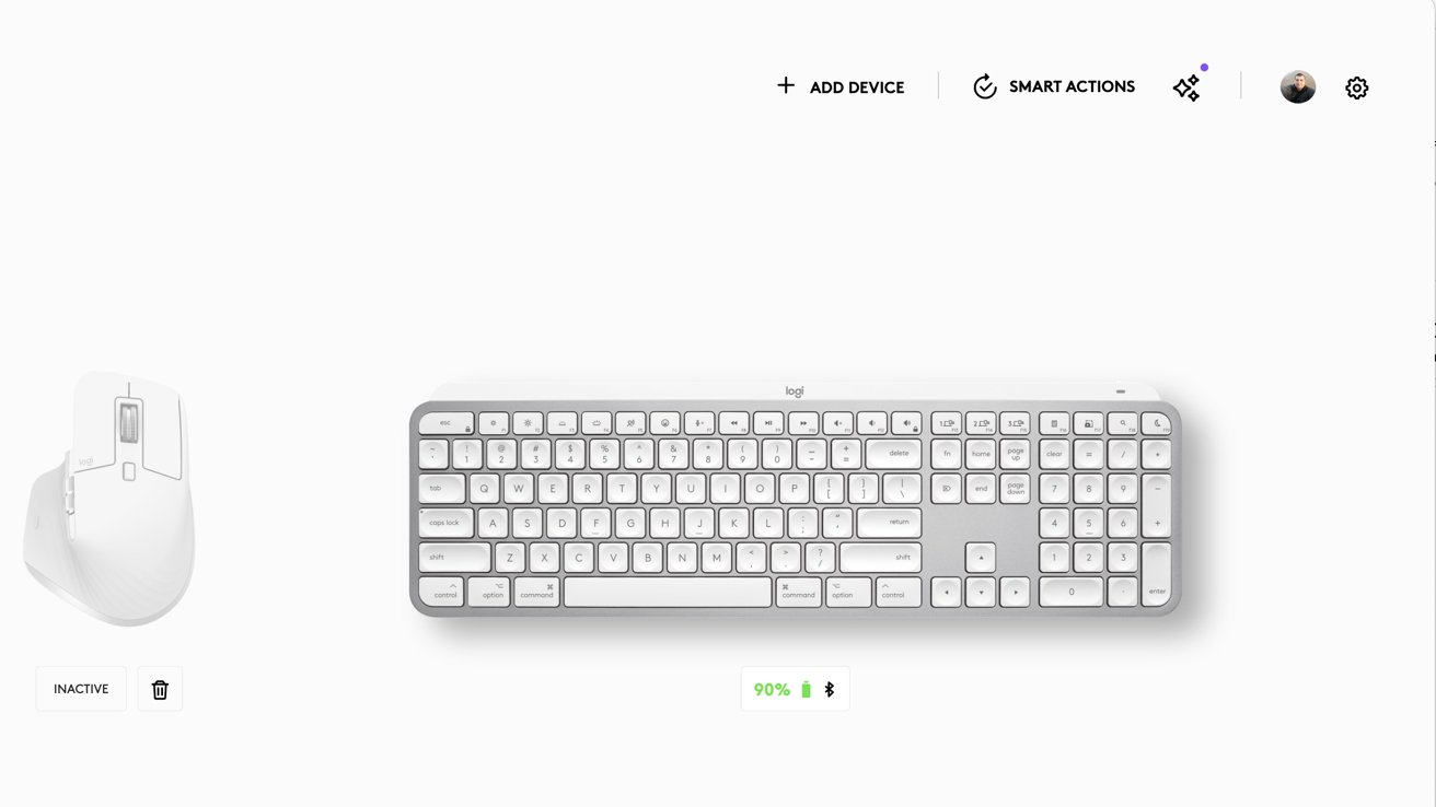 White ergonomic mouse and keyboard, battery status at 90%, options to add device, smart actions, and user profile at the top.