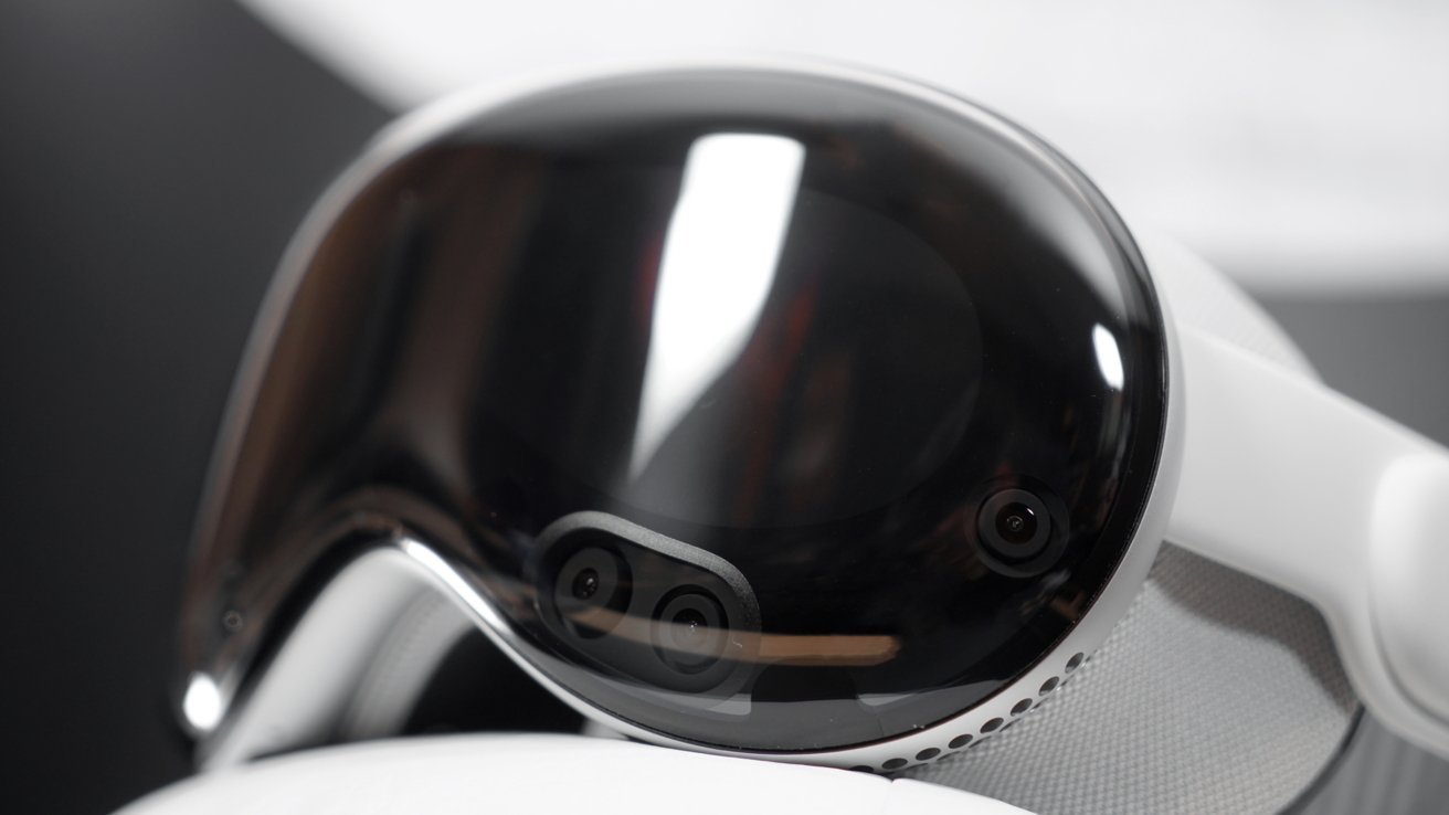 Black, glossy virtual reality headset with cameras on the front and white cushioning on the inside.