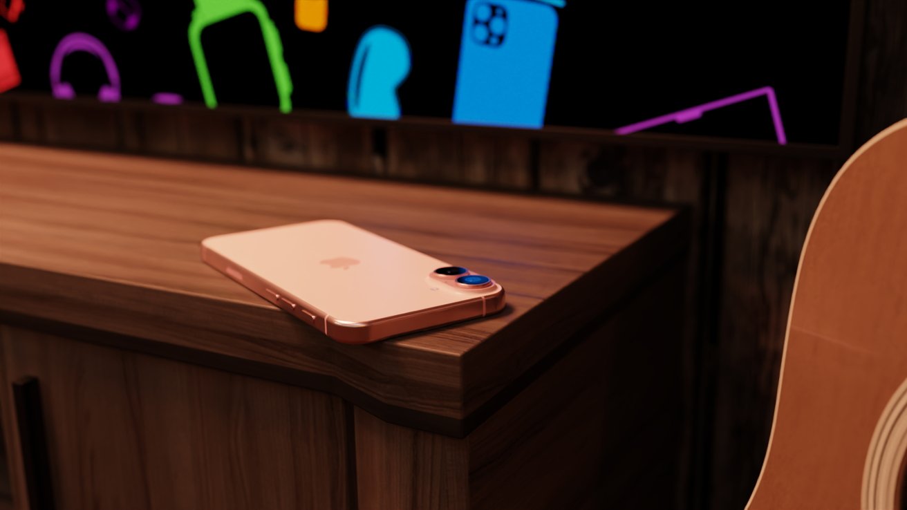 A render of the iPhone 16 on a table under a TV next to a guitar