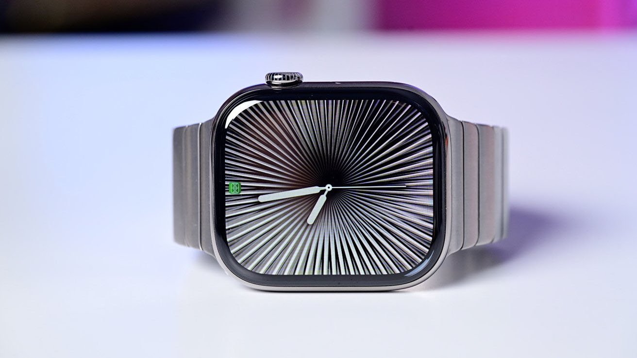 Apple Watch Series 10 with a metal link bracelet showing a dynamic, radial black and white pattern on the screen, indicating an active clock face.