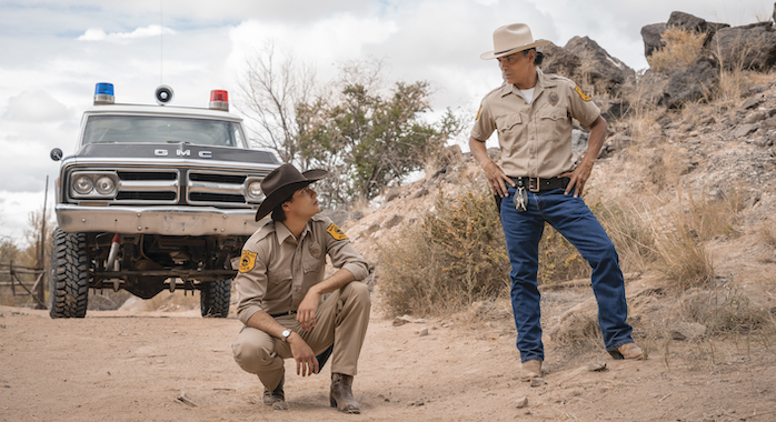 Zahn McClarnon as Joe Leaphorn and Kiowa Gordon as Jim Chee - Dark Winds _ Season 1, Episode 4 - Photo Credit: Michael Moriatis/Stalwart Productions/AMC