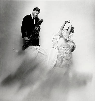 Wall Art - Photograph - Jazz Musician Gerry Mulligan and model Monique Chevalier by Bert Stern