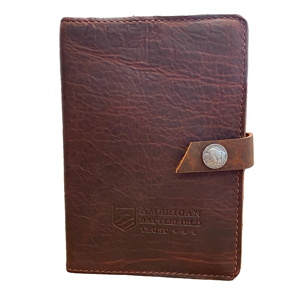 Front of leather journal snapped closed with buffalo nickel designed snap and the BT logo embossed