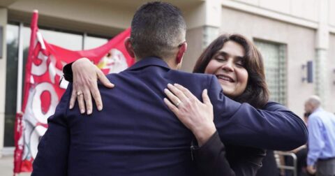 an unidentified supporter hugging defendant Wayne Hsiung, open rescue trial Sonoma